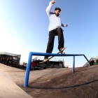 Warrick Smith rail grind on his skateboard