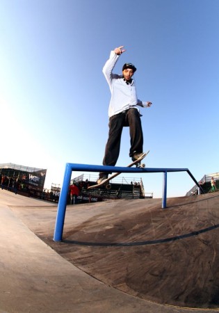 Warrick Smith rail grind on his skateboard