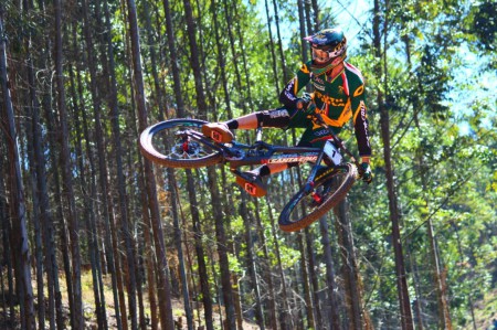 Downhill MTB rider Greg Minnaar boosting it at the World Championships last year