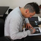 Thus Uys preparing the artwork for the tattoo