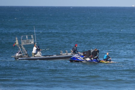 Surfers being rescued by the water safety team