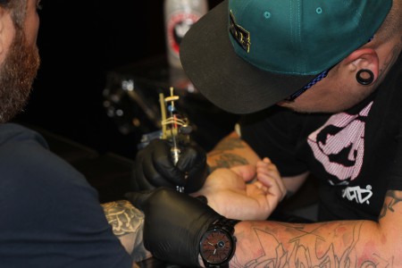 Grant Chapman tattooing out of SkullBox and Tattoo Company