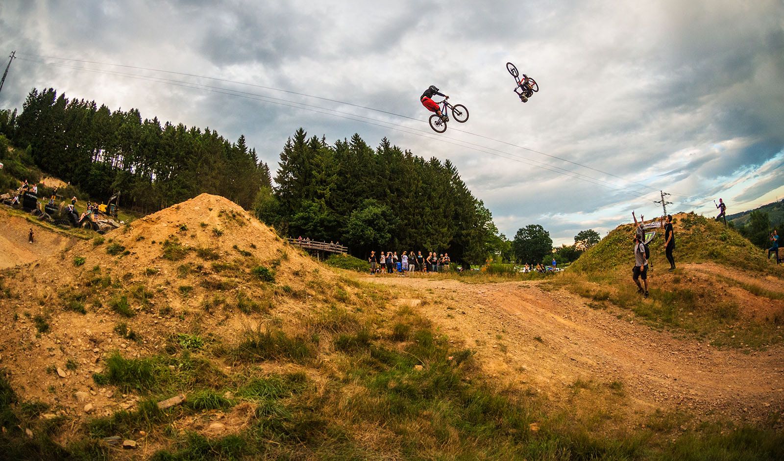 Freestyle MTB riders riding through the Loosefest course